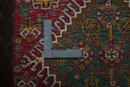 Backside of handmade 2000s Shiraz rug showing knot structure and weave density