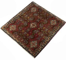 Corner detail of 2000s Shiraz rug showing border pattern and Wool pile