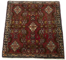 Surface texture of 2000s Shiraz rug with natural Wool and intricate pattern