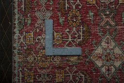 Backside of handmade 2000s Shiraz rug showing knot structure and weave density