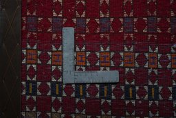 Backside of handmade 2000s Shiraz rug showing knot structure and weave density
