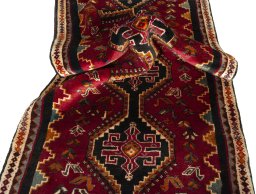 Corner detail of 2000s Shiraz rug showing border pattern and Wool pile