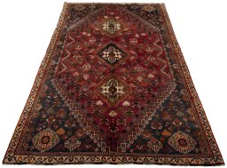 Surface texture of 2000s Shiraz rug with natural Wool and intricate pattern