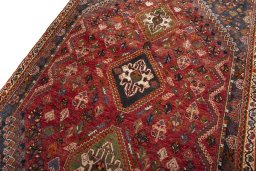 Backside of handmade 2000s Shiraz rug showing knot structure and weave density