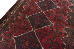 Backside of handmade 2000s Shiraz rug showing knot structure and weave density