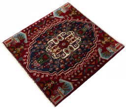 Corner detail of 2000s Shiraz rug showing border pattern and Wool pile