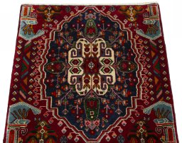 Surface texture of 2000s Shiraz rug with natural Wool and intricate pattern