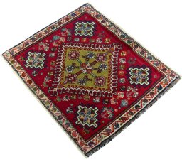 Corner detail of 2000s Shiraz rug showing border pattern and Wool pile