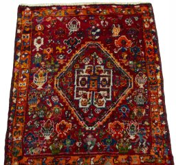 Surface texture of 2000s Shiraz rug with natural Wool and intricate pattern