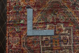 Backside of handmade 2000s Shiraz rug showing knot structure and weave density