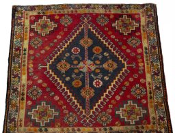 Surface texture of 2000s Shiraz rug with natural Wool and intricate pattern