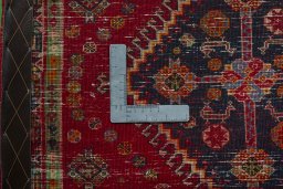 Backside of handmade 2000s Shiraz rug showing knot structure and weave density