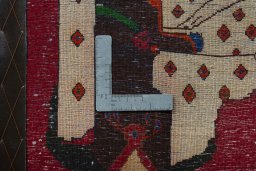 Backside of handmade 2000s Shiraz rug showing knot structure and weave density