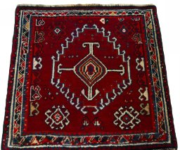 Surface texture of 2000s Shiraz rug with natural Wool and intricate pattern