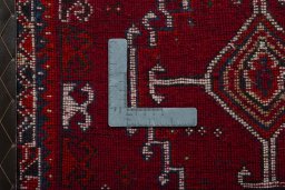 Backside of handmade 2000s Shiraz rug showing knot structure and weave density