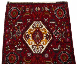 Surface texture of 2000s Shiraz rug with natural Wool and intricate pattern
