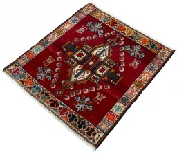 Corner detail of 2000s Shiraz rug showing border pattern and Wool pile