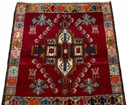 Surface texture of 2000s Shiraz rug with natural Wool and intricate pattern