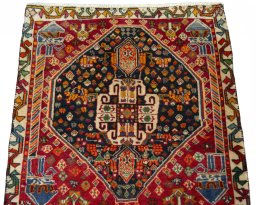 Surface texture of 2000s Shiraz rug with natural Wool and intricate pattern