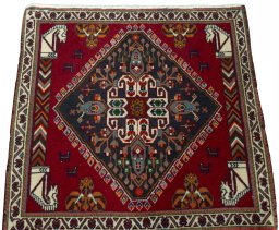 Surface texture of 2000s Shiraz rug with natural Wool and intricate pattern