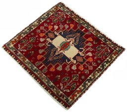 Corner detail of 2000s Shiraz rug showing border pattern and Wool pile