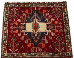 Surface texture of 2000s Shiraz rug with natural Wool and intricate pattern