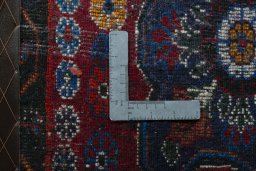 Backside of handmade 2000s Shiraz rug showing knot structure and weave density