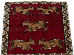 Surface texture of 2000s Shiraz rug with natural Wool and intricate pattern