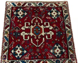 Surface texture of 2000s Shiraz rug with natural Wool and intricate pattern