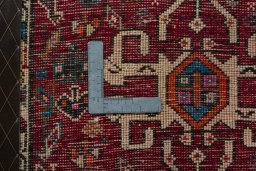 Backside of handmade 2000s Shiraz rug showing knot structure and weave density