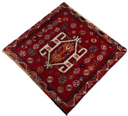 Corner detail of 2000s Shiraz rug showing border pattern and Wool pile