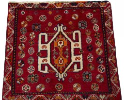 Surface texture of 2000s Shiraz rug with natural Wool and intricate pattern