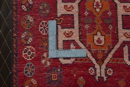 Backside of handmade 2000s Shiraz rug showing knot structure and weave density