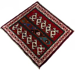 Corner detail of 2000s Shiraz rug showing border pattern and Wool pile