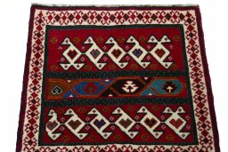 Surface texture of 2000s Shiraz rug with natural Wool and intricate pattern