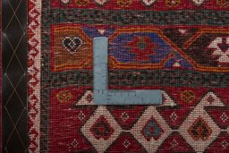 Backside of handmade 2000s Shiraz rug showing knot structure and weave density