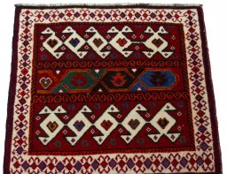 Surface texture of 2000s Shiraz rug with natural Wool and intricate pattern