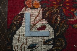 Backside of handmade 2000s Shiraz rug showing knot structure and weave density