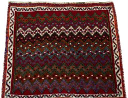 Surface texture of 2000s Shiraz rug with natural Wool and intricate pattern