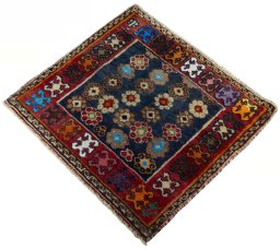 Corner detail of 2000s Shiraz rug showing border pattern and Wool pile