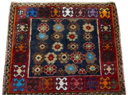 Surface texture of 2000s Shiraz rug with natural Wool and intricate pattern