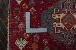 Backside of handmade 2000s Shiraz rug showing knot structure and weave density