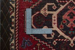 Backside of handmade 2000s Shiraz rug showing knot structure and weave density