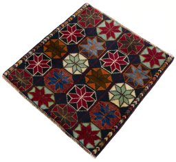 Corner detail of 2000s Shiraz rug showing border pattern and Wool pile