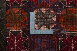 Backside of handmade 2000s Shiraz rug showing knot structure and weave density