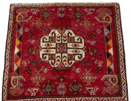 Surface texture of 2000s Shiraz rug with natural Wool and intricate pattern