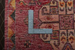 Backside of handmade 2000s Shiraz rug showing knot structure and weave density