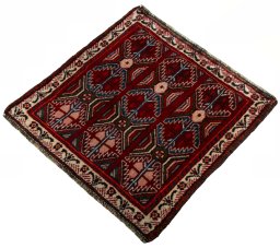 Corner detail of 2000s Shiraz rug showing border pattern and Wool pile