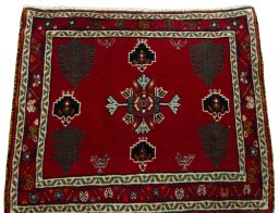 Surface texture of 2000s Shiraz rug with natural Wool and intricate pattern