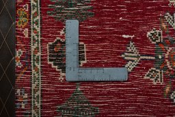Backside of handmade 2000s Shiraz rug showing knot structure and weave density